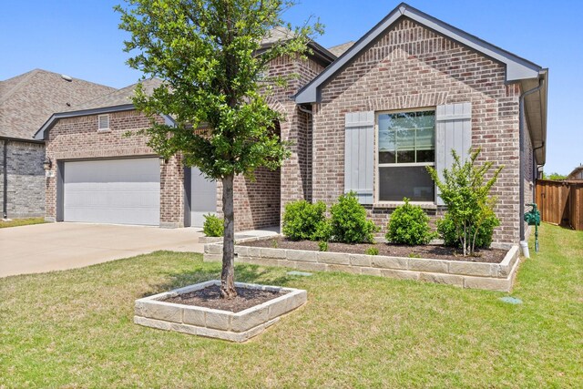 view of front of home featuring brick siding, a garage, and driveway