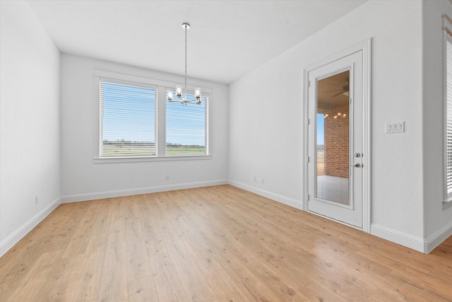 149 Highgate Ct, Boyd, TX 76023 - empty room featuring baseboards, an inviting chandelier, and light wood-type flooring