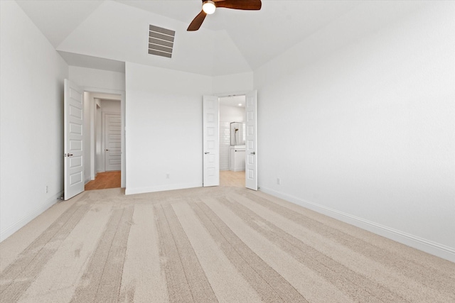 149 Highgate Ct, Boyd, TX 76023 - unfurnished bedroom with visible vents, vaulted ceiling, baseboards, connected bathroom, and light carpet