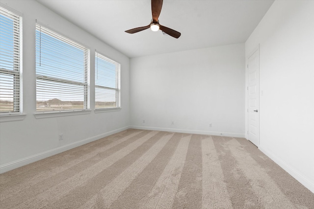 149 Highgate Ct, Boyd, TX 76023 - spare room featuring baseboards, ceiling fan, and light colored carpet