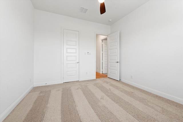 149 Highgate Ct, Boyd, TX 76023 - unfurnished bedroom featuring baseboards, light carpet, a ceiling fan, and visible vents