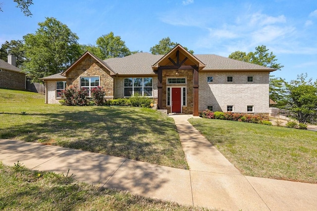 12090 Hackberry Holw, Tyler, TX 75706 - view of front of property with fence, stone siding, and a front lawn