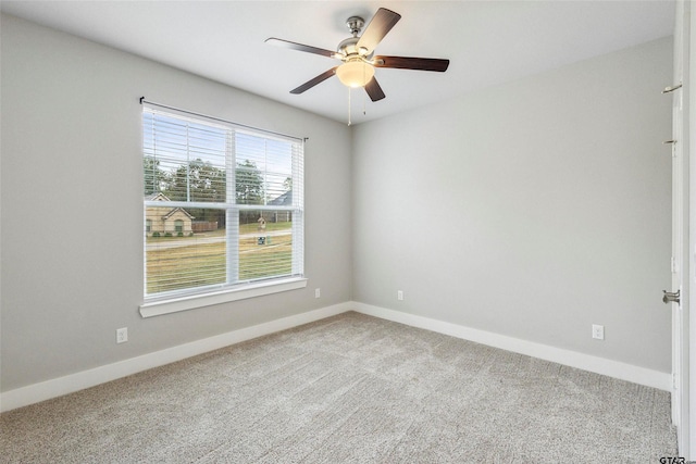 12090 Hackberry Holw, Tyler, TX 75706 - unfurnished room with baseboards, a ceiling fan, and carpet flooring