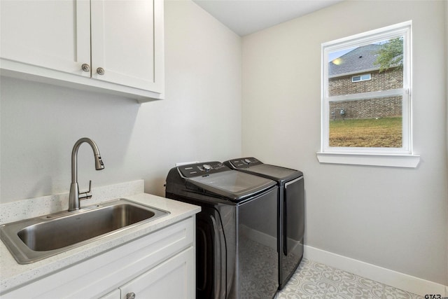 12090 Hackberry Holw, Tyler, TX 75706 - clothes washing area with cabinet space, baseboards, washing machine and dryer, and a sink
