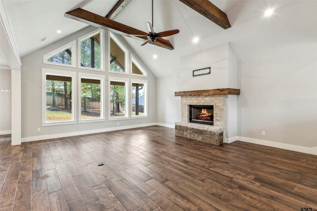 12090 Hackberry Holw, Tyler, TX 75706 - unfurnished living room featuring high vaulted ceiling, a stone fireplace, a ceiling fan, dark wood-type flooring, and beamed ceiling