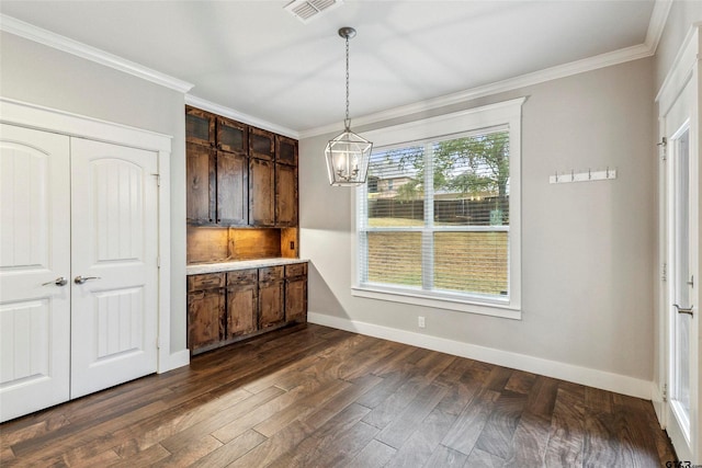 12090 Hackberry Holw, Tyler, TX 75706 - unfurnished dining area with crown molding, a notable chandelier, baseboards, visible vents, and dark wood-style floors