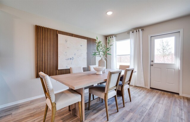 dining area with baseboards, recessed lighting, and light wood-style flooring
