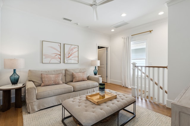 living area with visible vents, recessed lighting, and light wood-style floors