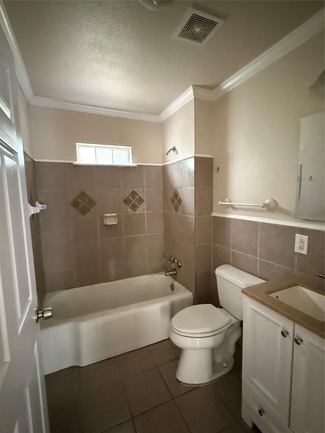 bathroom with visible vents, crown molding, toilet, shower / bathing tub combination, and tile patterned floors