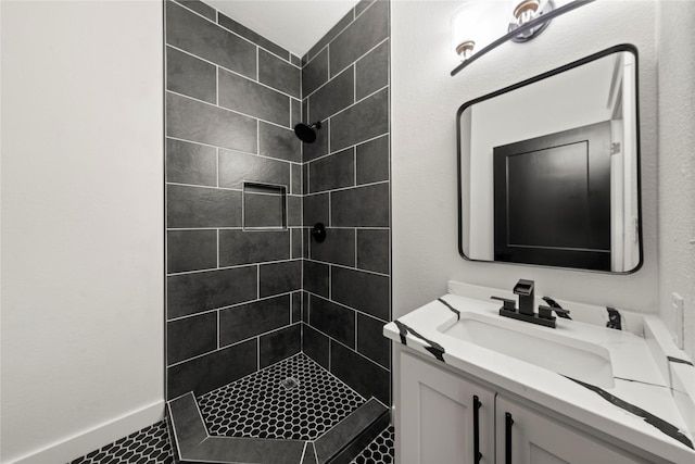 full bath featuring a shower stall and vanity