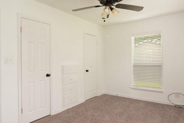 5524 Korth St, Sansom Park, TX 76114 - unfurnished bedroom with carpet flooring, a ceiling fan, and baseboards