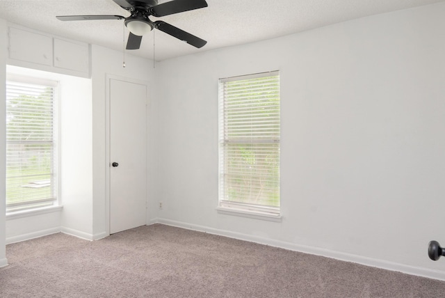 5524 Korth St, Sansom Park, TX 76114 - empty room featuring light carpet, ceiling fan, baseboards, and plenty of natural light