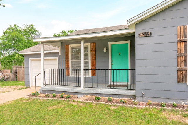 5524 Korth St, Sansom Park, TX 76114 - view of exterior entry featuring covered porch, an attached garage, concrete driveway, a lawn, and roof with shingles