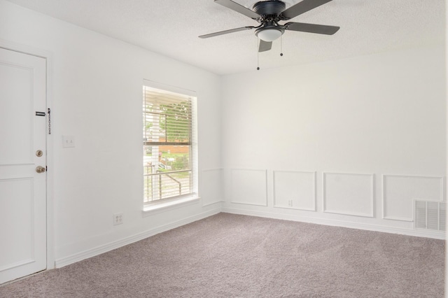 5524 Korth St, Sansom Park, TX 76114 - spare room with carpet, ceiling fan, and a textured ceiling