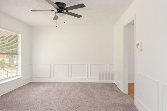 5524 Korth St, Sansom Park, TX 76114 - unfurnished room featuring light colored carpet, ceiling fan, and a textured ceiling