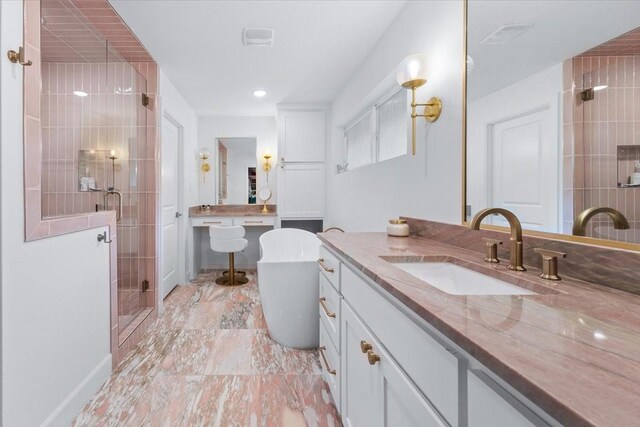 bathroom with vanity, marble finish floor, a freestanding tub, recessed lighting, and a shower stall