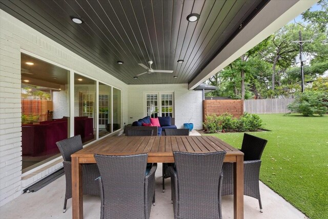 view of patio with fence and ceiling fan