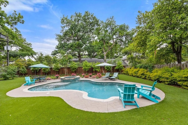 view of swimming pool with a patio, a fenced backyard, a lawn, and a pool with connected hot tub