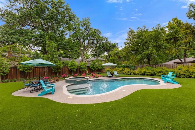 view of pool featuring a lawn, a fenced backyard, a pool with connected hot tub, and a patio area