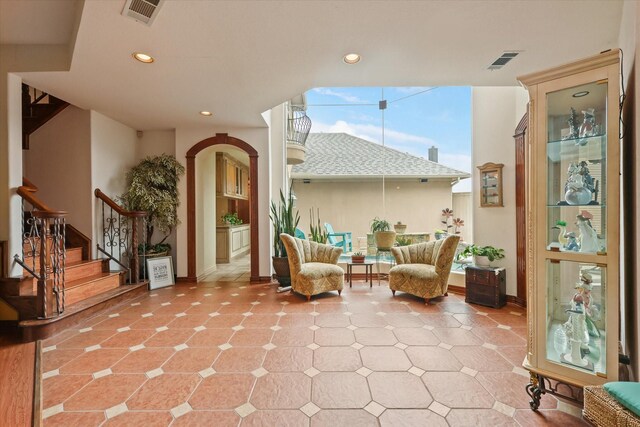 interior space with an outdoor living space and visible vents