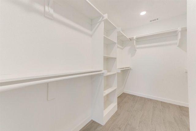 1130 Amsden Cir, Denison, TX 75020 - walk in closet featuring visible vents and light wood-style flooring