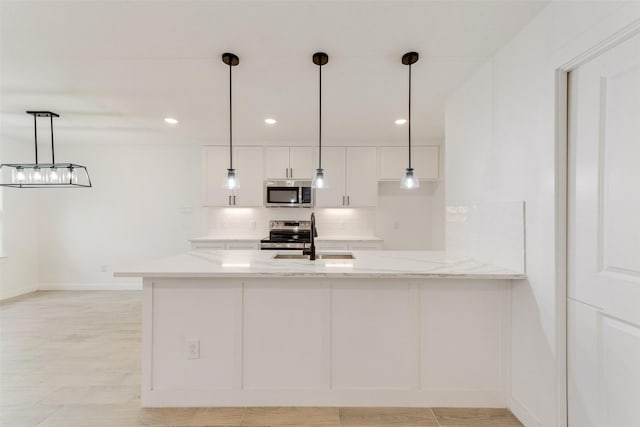 1130 Amsden Cir, Denison, TX 75020 - kitchen featuring light stone countertops, baseboards, white cabinets, a sink, and appliances with stainless steel finishes