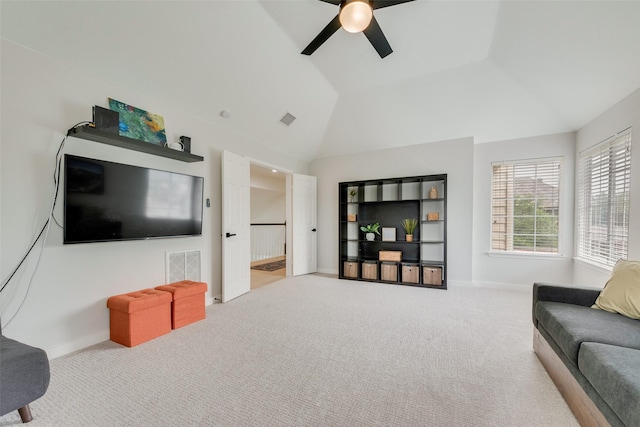 carpeted living area featuring baseboards, a ceiling fan, high vaulted ceiling, and visible vents