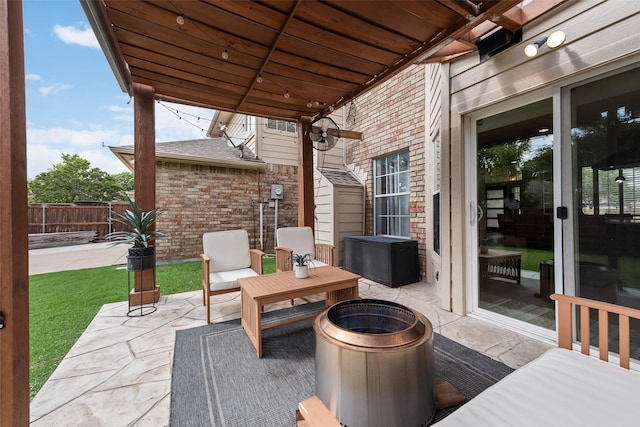 view of patio with a fenced backyard and an outdoor fire pit