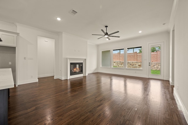 526 Windchase Dr, Haslet, TX 76052 - unfurnished living room with crown molding, ceiling fan, dark wood-type flooring, a glass covered fireplace, and recessed lighting