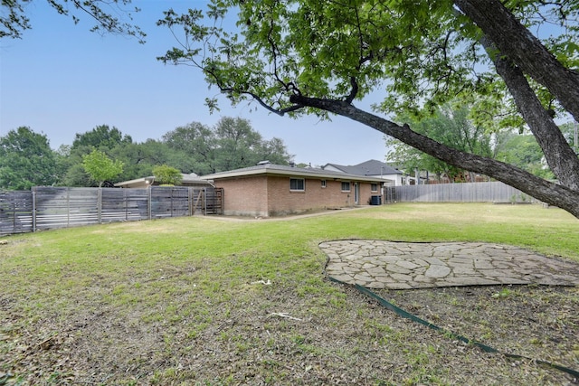view of yard featuring a fenced backyard and a patio area