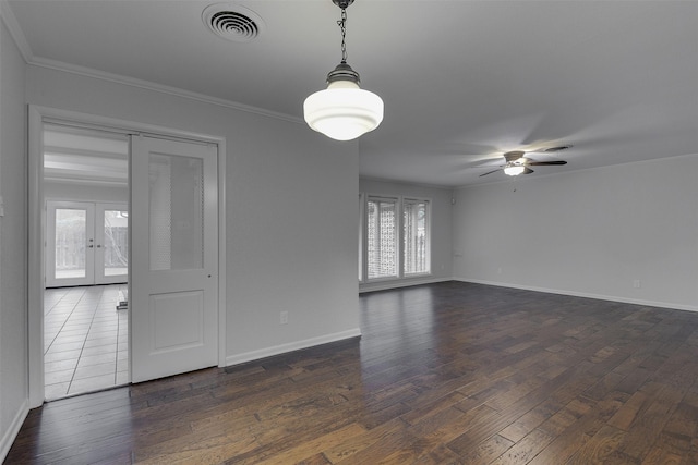 spare room with visible vents, crown molding, baseboards, french doors, and a ceiling fan