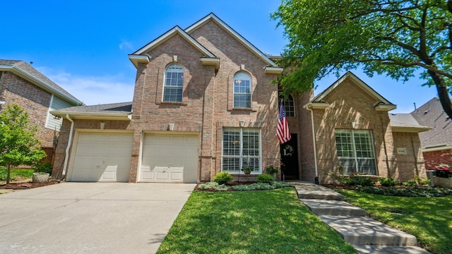 traditional home with brick siding, driveway, and a front yard