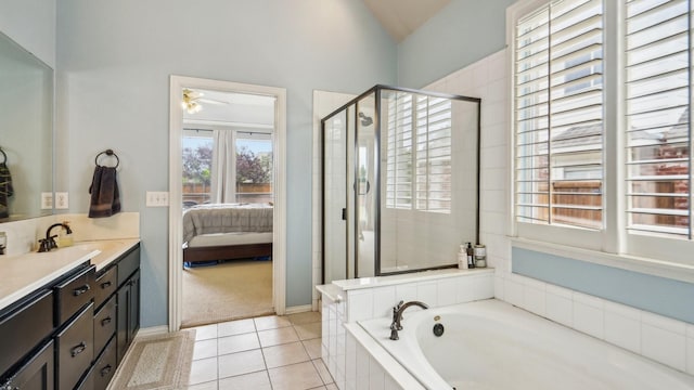 ensuite bathroom with connected bathroom, vanity, a shower stall, vaulted ceiling, and a bath