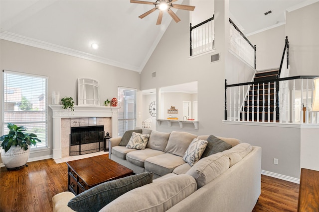 6017 Madera Ct, Plano, TX 75024 - living area with ceiling fan, wood finished floors, a fireplace, plenty of natural light, and crown molding