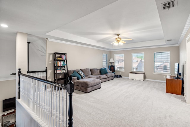6017 Madera Ct, Plano, TX 75024 - carpeted living room with a raised ceiling, a ceiling fan, baseboards, and crown molding