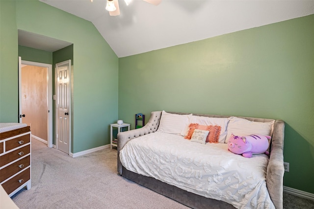 carpeted bedroom featuring baseboards, ceiling fan, and lofted ceiling