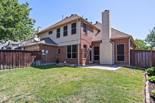 back of property with a patio, a fenced backyard, a yard, and a chimney