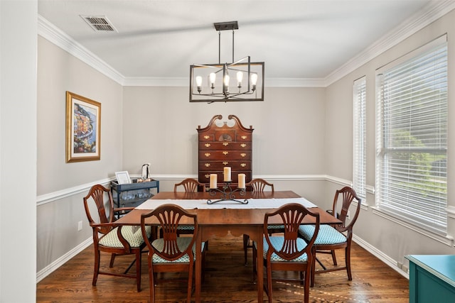6017 Madera Ct, Plano, TX 75024 - dining space featuring wood finished floors, a chandelier, crown molding, and baseboards
