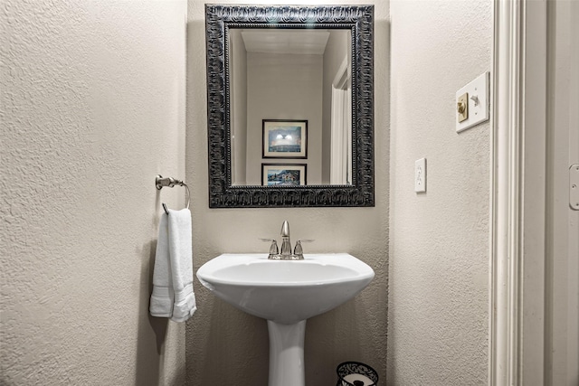 bathroom with a textured wall