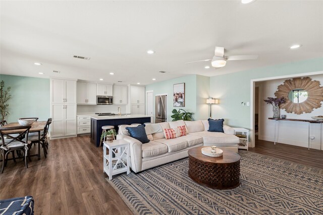 living area featuring a ceiling fan, recessed lighting, wood finished floors, and visible vents