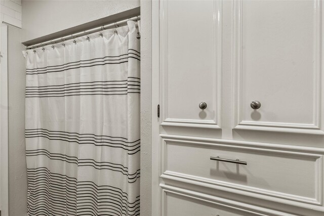 full bathroom with a shower with curtain