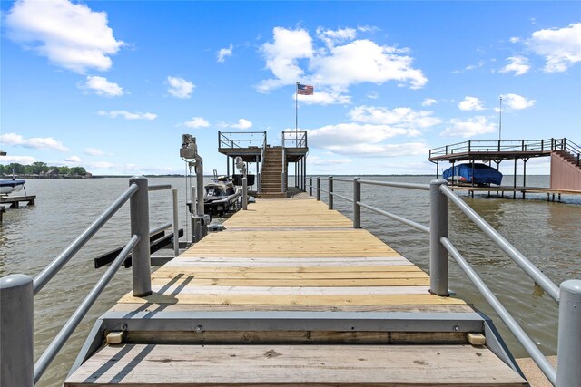 view of dock featuring a water view and boat lift