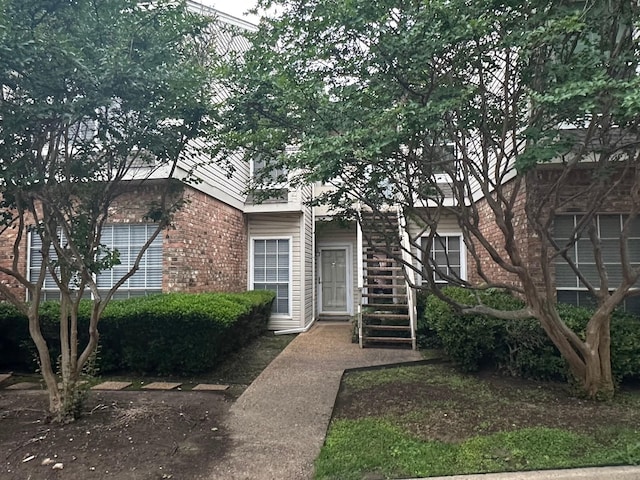 view of front of property featuring brick siding