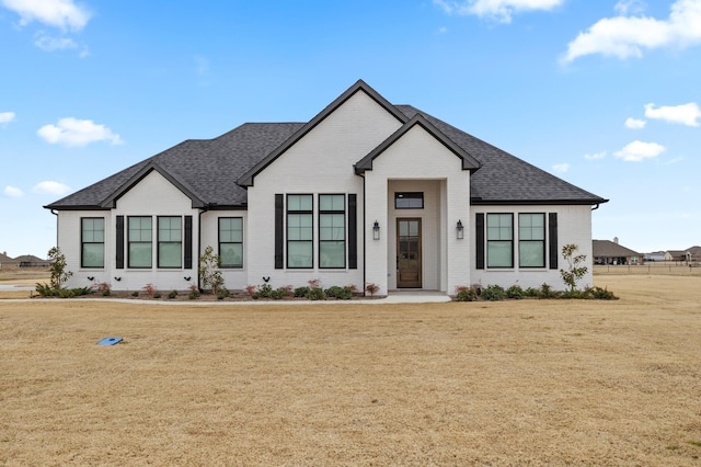 4771 Sasha Way, Caddo Mills, TX 75135 - modern inspired farmhouse with brick siding, roof with shingles, and a front yard