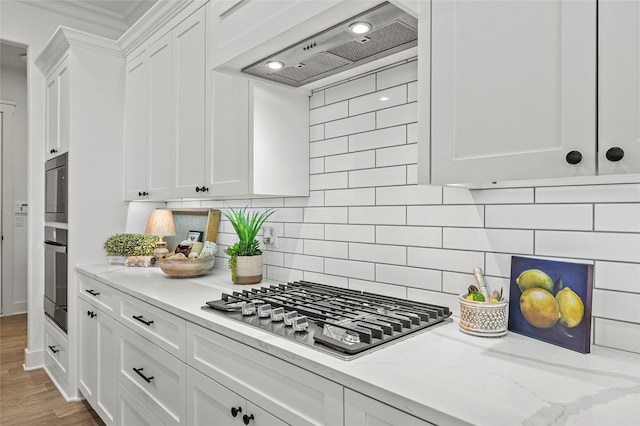 4771 Sasha Way, Caddo Mills, TX 75135 - kitchen featuring decorative backsplash, crown molding, premium range hood, stainless steel gas stovetop, and white cabinetry