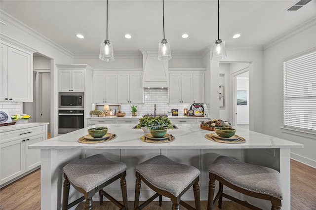 4771 Sasha Way, Caddo Mills, TX 75135 - kitchen with visible vents, decorative backsplash, wall oven, premium range hood, and built in microwave
