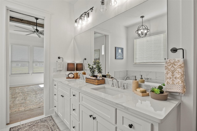 4771 Sasha Way, Caddo Mills, TX 75135 - full bath with a sink, ceiling fan with notable chandelier, double vanity, and a healthy amount of sunlight