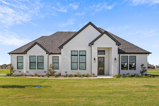 4771 Sasha Way, Caddo Mills, TX 75135 - modern farmhouse style home with roof with shingles, a front yard, and brick siding