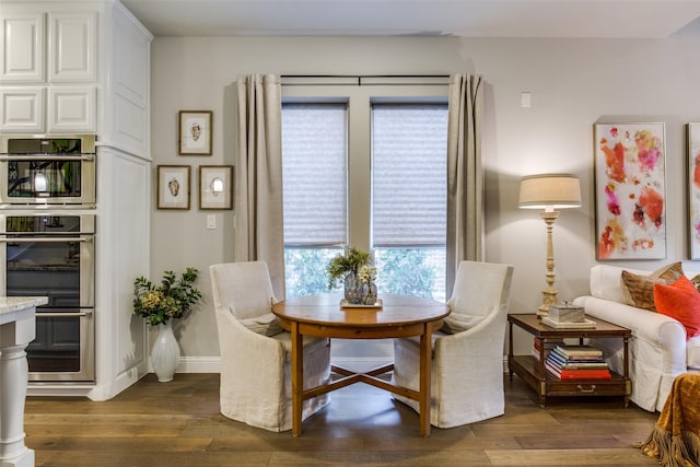 living area featuring dark wood-type flooring