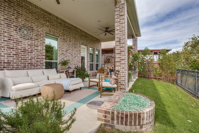 view of patio / terrace featuring an outdoor living space, a fenced backyard, and ceiling fan